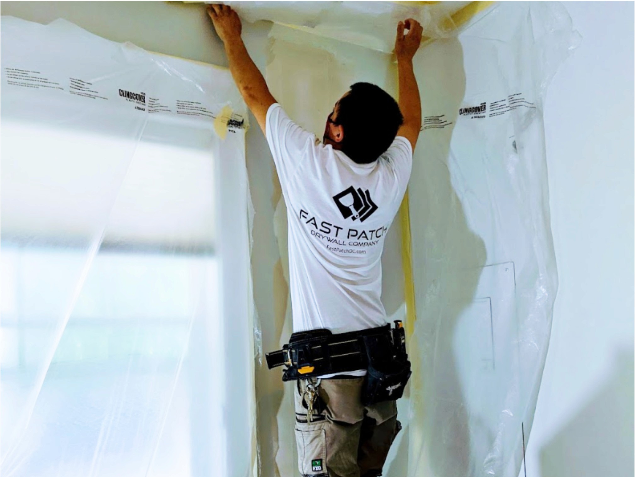 Fast Patch Drywall technician finishing a ceiling repair in a dust-controlled work zone in Seattle