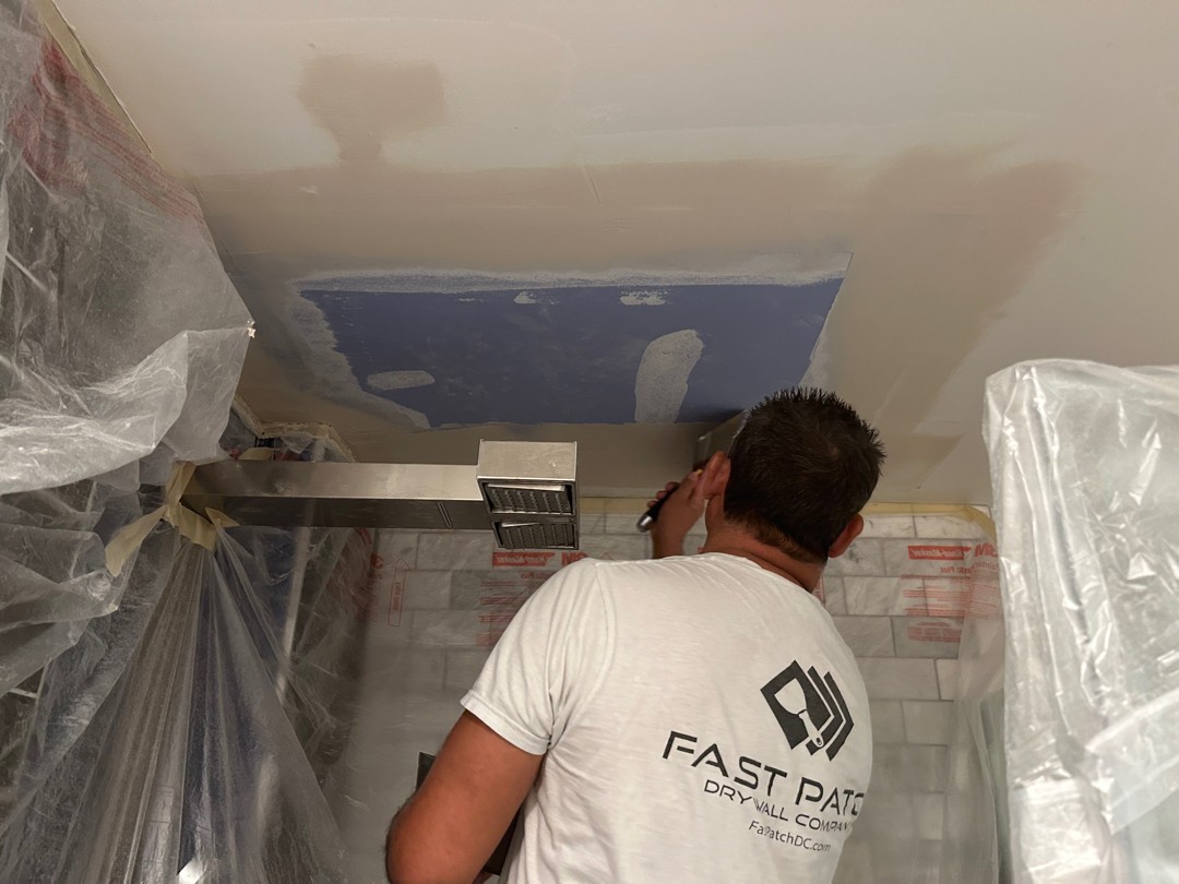 Ceiling repair in progress with dust containment in a Seattle home